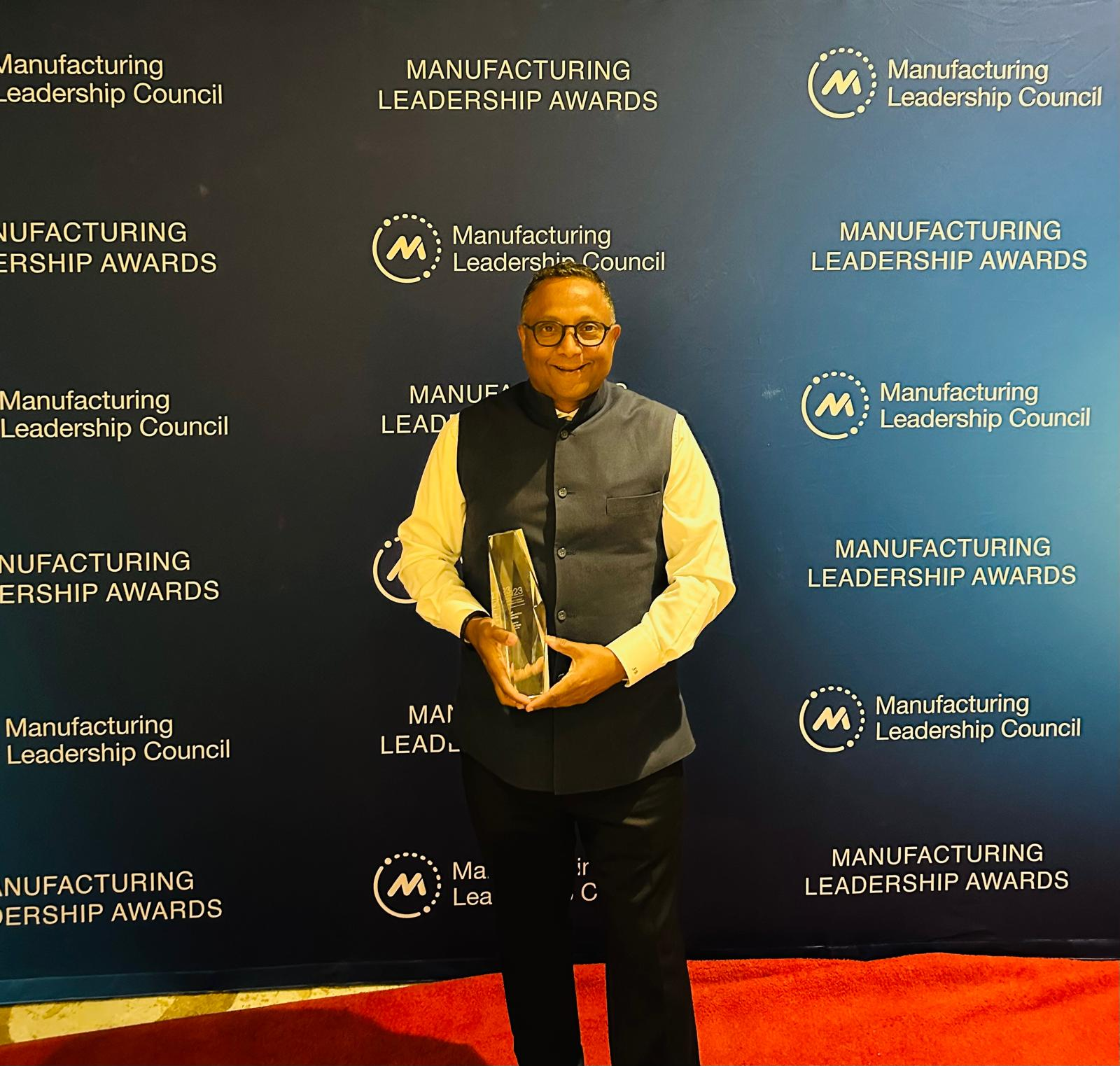 Suvajit Basu portrait with the Manufacturing Leadership Award