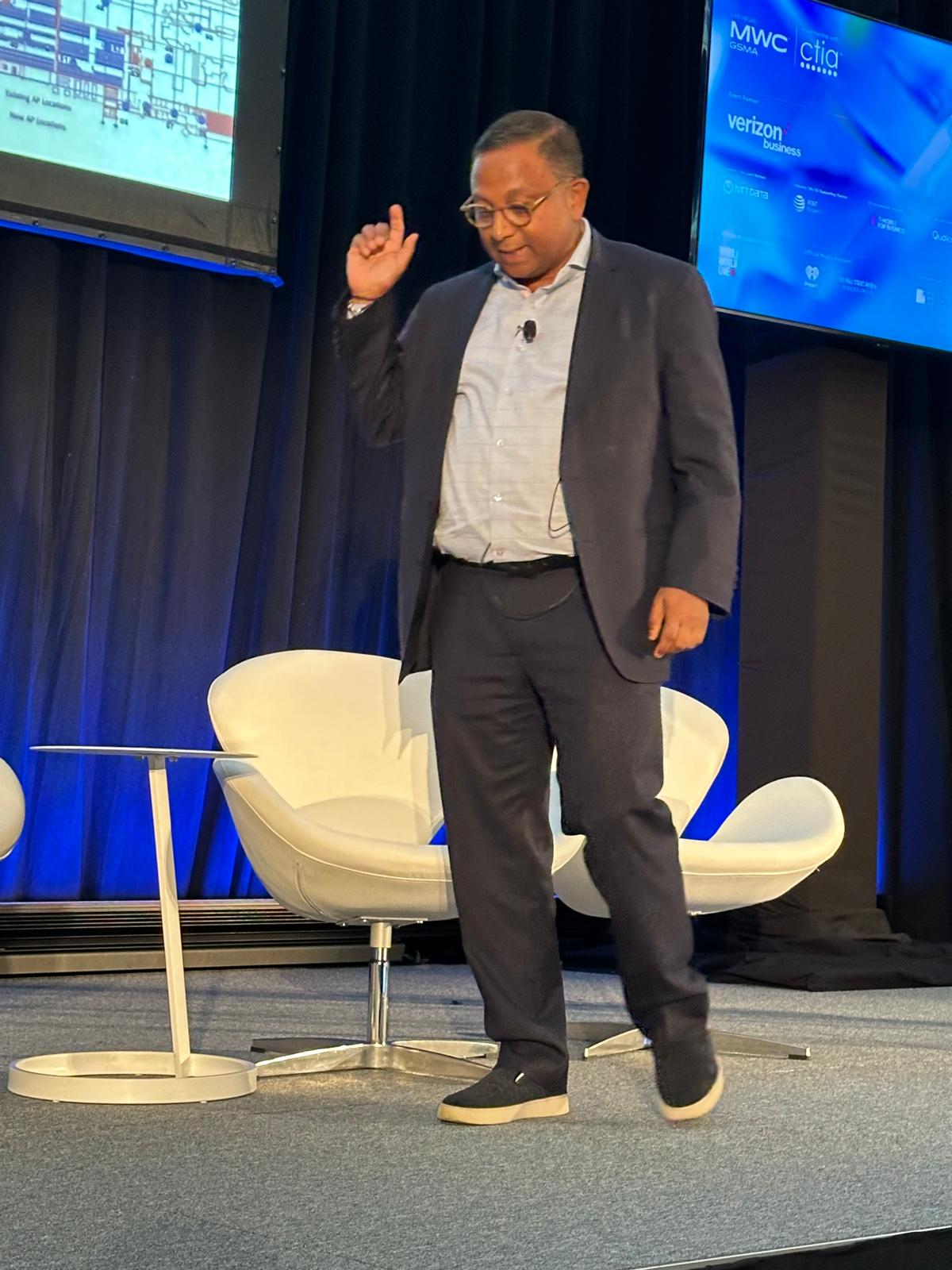 Suvajit Basu mid-point gesture while speaking at MWC